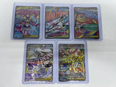 four card game cases with various comics on them on a white surface