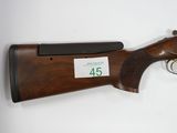 a rifle with a 45 - caliber rifle on the side of it