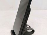 a cell phone that is sitting on top of a stand