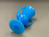 a blue cup that is sitting on a table