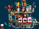 a large lego castle with a lot of people inside of it