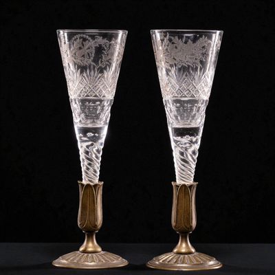 a pair of etched glass goblets with gold accents