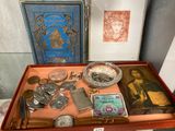 a wooden box with a variety of items in it