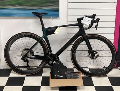 a bike that is sitting on a box on a checkered floor