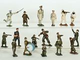 many figurines of soldiers on display on a shelf