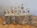 a lot of beer glasses sitting on a table