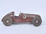 a red toy car with a number 3 on it