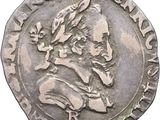 a close up of a coin with an image of a man on it