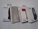 three sony headphones are sitting on top of a white box