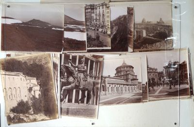 many old photos hanging on the wall of a building