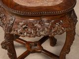 a wooden table with a marble top on it