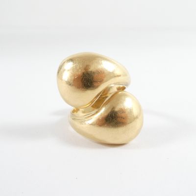 an image of a close up of a gold object on a white surface