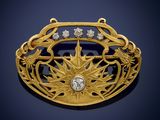 a gold and diamond broochle, by van cleef