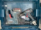 two power tools in a blue case on the ground