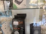 many electronic gadgets on display in a glass case