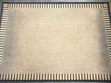 beige and black area rug with a black border on top of it