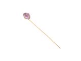 a close up of a stick with a purple stone on it