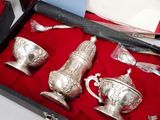 a box with silverware in it on a red cloth