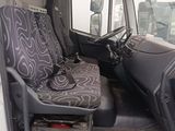 a seat in the back of a truck with a seat cushion