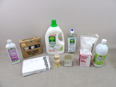 a lot of cleaning products that are on the table