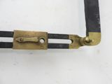 an image of a pair of brass pliers sitting on top of a white surface
