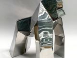 a sculpture of a dog made out of metal