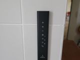 a remote control on the wall in the kitchen