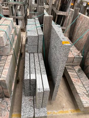 a large pile of granite blocks sitting on the ground