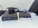 two computers that are sitting on a white table