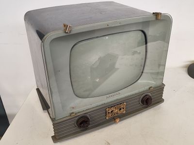 an old television sitting on a table in a room