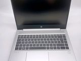 a laptop computer sitting on a table with a white background