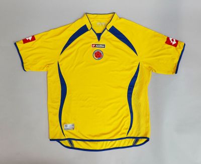 the shirt is yellow with blue trims and a red and white stripe