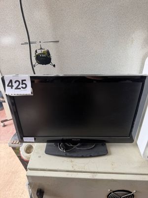 a flat screen tv sitting on top of a dresser
