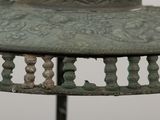 a close up of a metal object with a bird on it