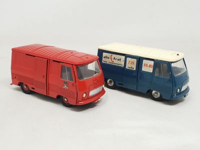 two toy trucks that are sitting next to each other