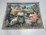 a tapestry with a picture of a woman and animals on it