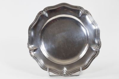 an antique silver plate on a stand on a white background