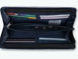 leather wallet with multiple credit cards and a pen in it