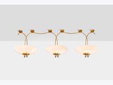 a set of three brass and glass wall lights