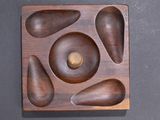 an overhead view of a wooden plate with several pieces of wood in it