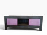 purple and black tv stand with two doors on top of it