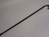 a close up of a cane on a table with a white background