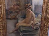 a painting of a nude woman sitting on a bed