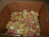 a cardboard box filled with lots of fruit and vegetables