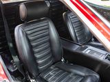 a red car with black leather seats in the back of it