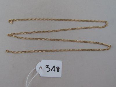 a close up of a gold chain with a price tag on it