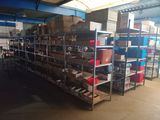 many shelves that are filled with boxes and containers