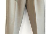 a pair of pants hanging on a hanger on a wall