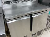 a stainless steel counter top with a microwave on top of it