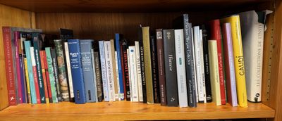 a book shelf with many books on top of it
